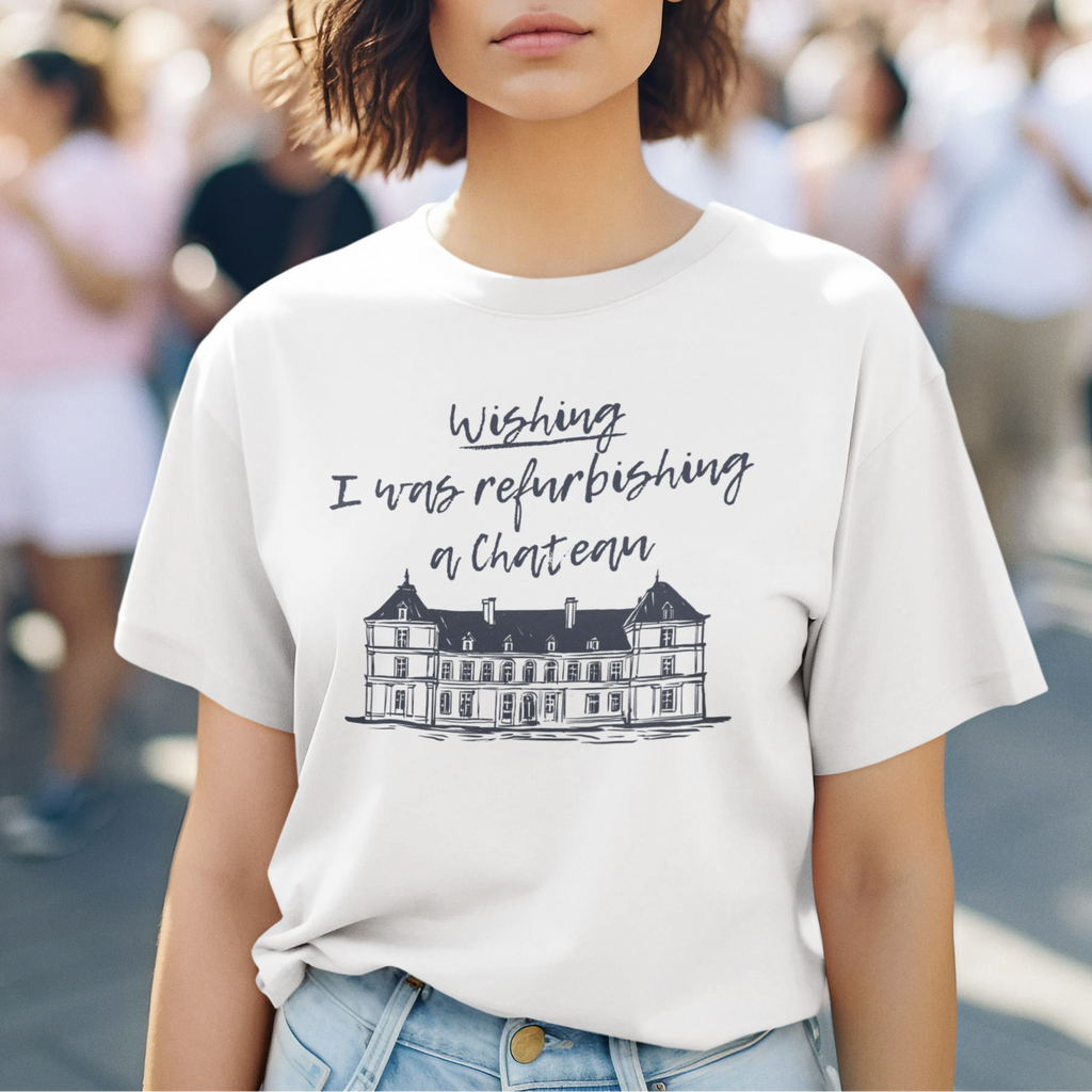 A person wearing the "I wish I was refurbishing a chateau" shirt in a relaxed, comfortable fit. Stylish and sensory-friendly apparel for the beautifully overwhelmed.

