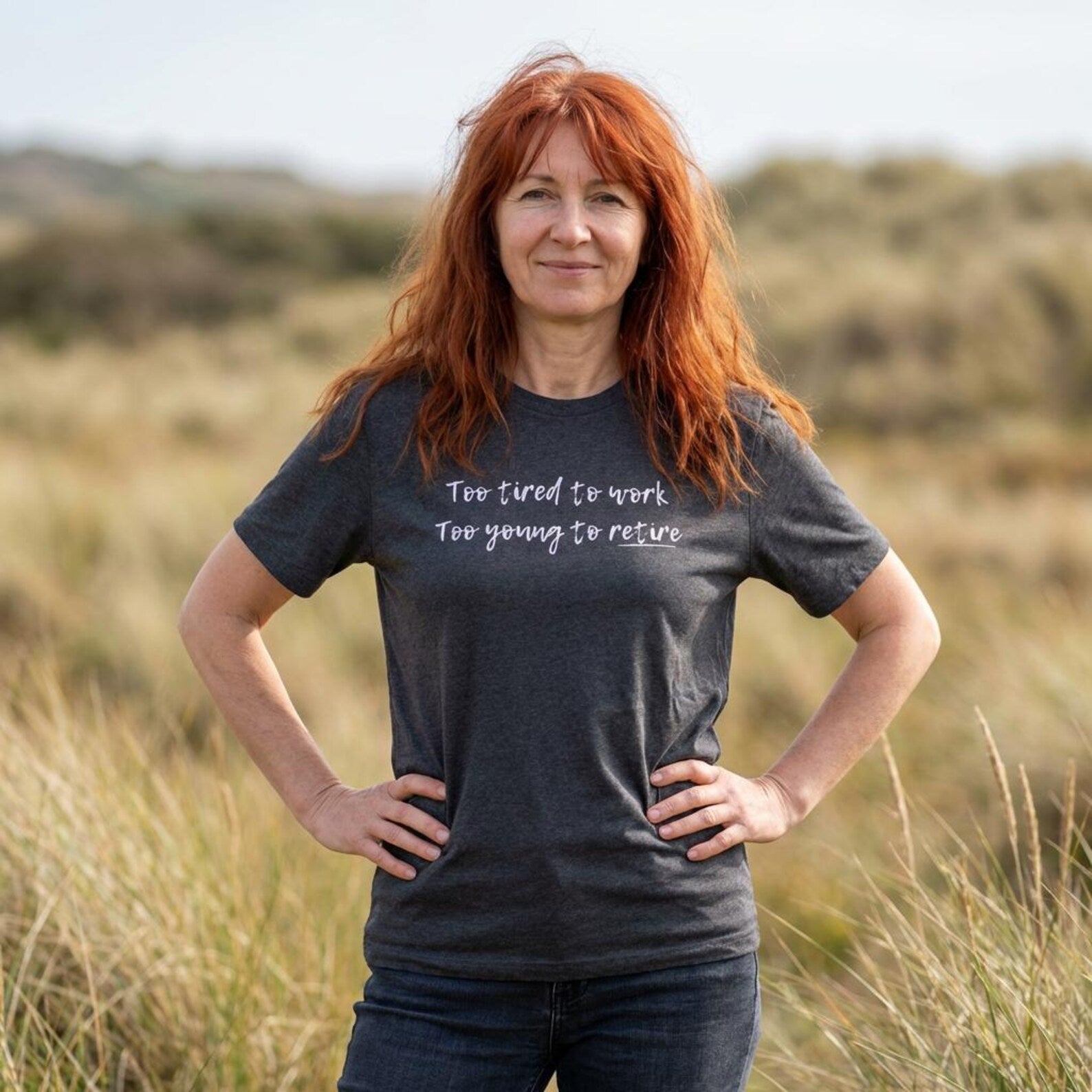 Woman wearing a t-shirt with text in a field